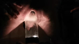 PV TAking Lit Glass Bottle With Head In Back Porch