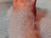 Hot blonde massaging her wet soapy feet in the bath 5/16