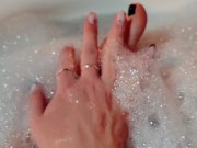 Hot blonde massaging her wet soapy feet in the bath 6/16