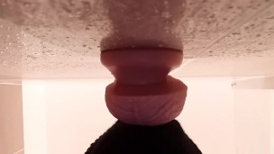 Masked guy sucks dildo