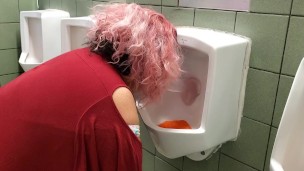 Sucking a dildo inside a Public Urinal!