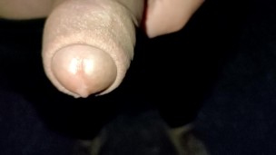Close up slow motion - Cum dripping out of uncut cock
