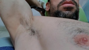 Muscle guy masturbating while watching porn