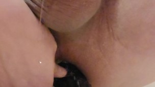 Asian guy moans while riding massive 12" dragon dildo