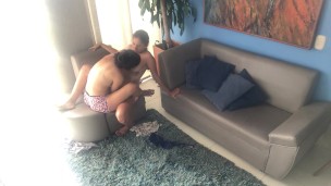 Kissing with my neighbor on the couch, we take off our shirts and scissor