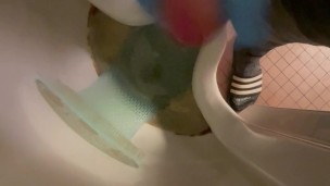 Wanking in urinal with blue nitrile gloves