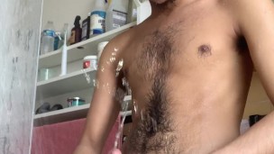 Hairy guy pisses himself in the shower