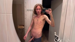 Cute guy strips down nude and jerks off before sauna