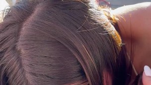 Intimate teasing between real lesbian couple outdoors for neighbors to see