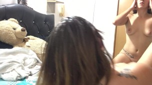 Beautiful blonde plays with her thong in her pussy. Her girlfriend enters the room in a towel. She p