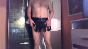 muscular man poses in leather