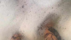 Rubbing tons of lotion and oil over my tattooed feet and huge tits then ride my huge dildo