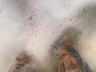 Rubbing tons of lotion and oil over my tattooed feet and huge tits then ride my huge dildo