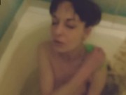 Skinny brunette gives a footjob in the bathroom