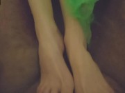 Skinny brunette gives a footjob in the bathroom 7/16