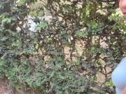 beautiful skinny brunette is filmed by her boyfriend while she changes her blouse on the street