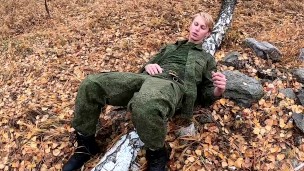 military man jerks off his dick in the forest