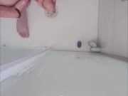Massaging the dick in the bathtub