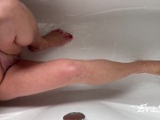 Big-breasted MILF pisses lying in the bathroom 1/16