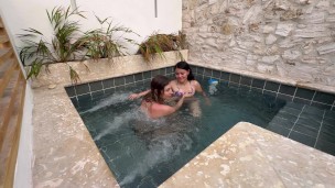 Two hot lesbians masturbate in a public pool, afraid of being discovered.