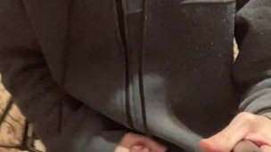 A guy in a gray sweater on a chair cums with a waterfall