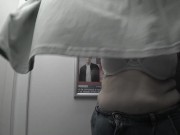 In the fitting room I try on T-shirts. 1/16