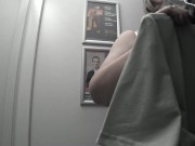 In the fitting room I try on T-shirts. 6/16