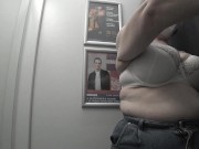 In the fitting room I try on T-shirts. 7/16