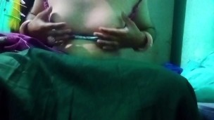 Indian Gay Crossdresser in pink saree pressing and milking his boobs so hard and enjoying the hardco