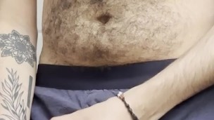 hairy chest hung guy through the fly of his boxers blows a huge load into cup