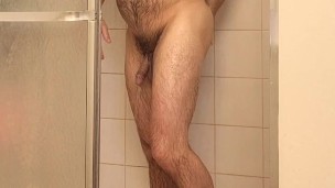 Hairy muscle bear showers and flexing