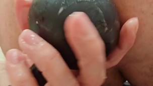 Bent over, stretching my tight ass with inflatable anal beads