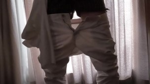 A Japanese man masturbates in a dimly lit room with the curtains closed so his family won't find out