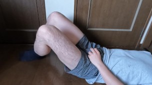 A Japanese man lies down, rubs his dick and masturbates while wearing underpants.