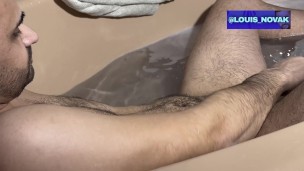 Taking a bath and jacking my hairy uncut cock!