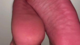 oily ebony feet rubbing together and stepping on you pov