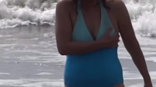 Beautiful stepmom showing off on the beach and making cocks hard