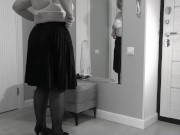 A mature, fat milf with big, saggy tits is changing clothes in front of the mirror. 14/16