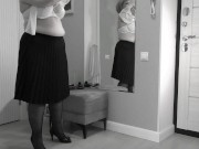 A mature, fat milf with big, saggy tits is changing clothes in front of the mirror. 15/16