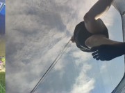 Tall girl in shorts jumping barefooted on a trampoline (slowed down) bottom view 10/16