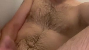 Straight bearded lad plays and pisses in the bath tub while the shower is running
