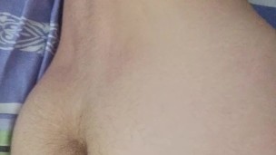 Young twink playing with his hairy uncut dick