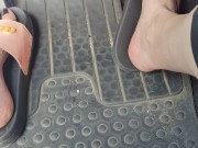 Revving the pedals of my mini Cooper with my pink Adidas slides 13/16