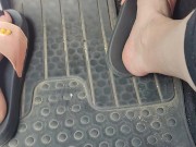 Revving the pedals of my mini Cooper with my pink Adidas slides 15/16