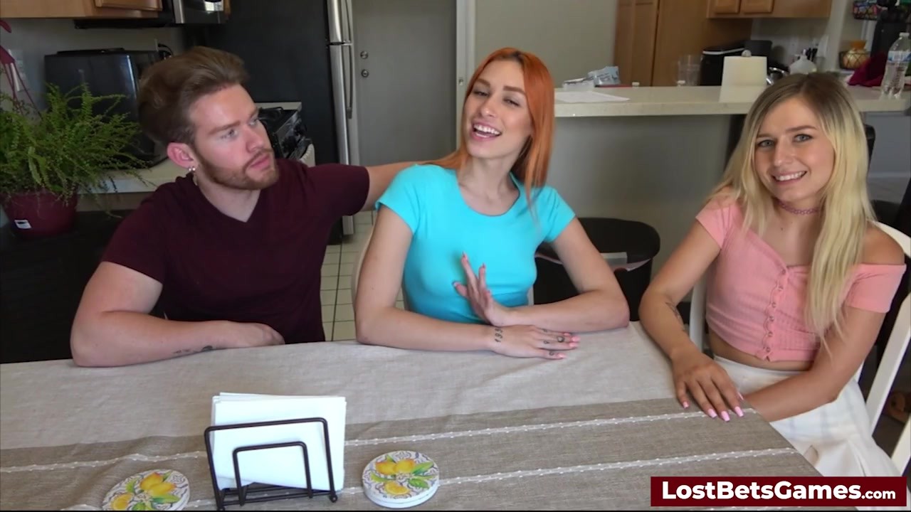 Two sexy women playing a strip game with their horny friend