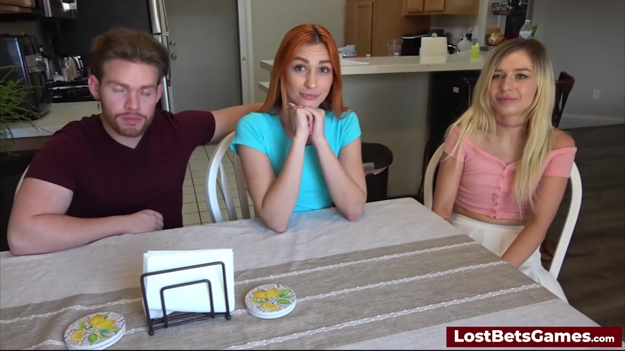 Two sexy women playing a strip game with their horny friend