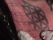 Busty tattooed chick gets new ink then sucks on two dicks 10/16