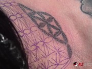 Busty tattooed chick gets new ink then sucks on two dicks 7/16