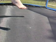 Slow motion jumping on a trampoline in shorts & T-shirt regular woman jumping not a big tit slut 12/16