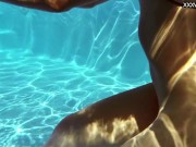 Perfect body brunette enjoys naked swimming 10/16